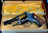 S & W = PRE MODEL 10 , m&p = BLUE = FOUR (4) INCH =98% CONDITION = Grey / Gray / Silver box w/ S&W paper wrap == - Image 2 of 13