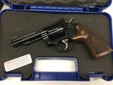 Smith & Wesson 150717 Model 48 Classic 22 Mag Caliber with 4" Barrel, 6rd Capacity Cylinder, Overall Blued Finish Carbon Steel & Wood Grip - 1 of 5