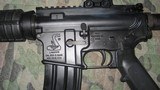 Bushmaster .223-5.56 Model XM 150E2S with Primary Arms SLX Red Illum. Sight - 3 of 12