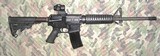 Bushmaster .223-5.56 Model XM 150E2S with Primary Arms SLX Red Illum. Sight - 1 of 12