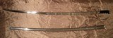 US 1902 Pattern Army Officer’s Sword, E Pluribus Unum engraved WWI two ring metal saber with original metal scabbard. - 1 of 13