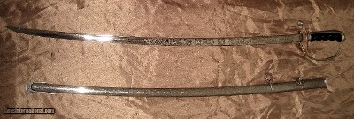 US 1902 Pattern Army Officer’s Sword, E Pluribus Unum engraved WWI two ring metal saber with original metal scabbard.