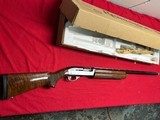 REMINGTON MODEL 1100 SPORTING SEMI AUTO 12 GA SHOTGUN - 1 of 21