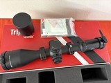 TRIJICON RIFLE SCOPE 4.5-30x56mm TENMILE RED/GREEN MOA PRECISION TREE - 1 of 14