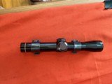 LEUPOLD M8 PISTOL SCOPE 2x WITH WEAVER RIINGS - Image 1 of 8