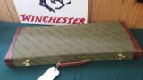 4670Winchester green hard case with leather sides. Has 27