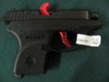 6118 Ruger LCP-C Custom 380 caliber 2.75 inch barrel, 6 round magazine, Matt Black finish, extended finger grip on bottom of mag,gun rug,wide red alum - 3 of 6