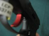 6115 Ruger LCP-C Custom 380 caliber 2.75 inch barrel, 6 round magazine, Matt Black finish, extended finger grip on bottom of mag,gun rug,wide red alum - 5 of 6