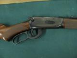 6199 Winchester 94 Legacy 30/30 24 inch barrel, semi buckhorn site, NEW IN BOX WITH ALL PAPERS, last made 2006. nice straight grain stock and forend,
- 9 of 12