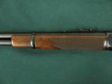 6199 Winchester 94 Legacy 30/30 24 inch barrel, semi buckhorn site, NEW IN BOX WITH ALL PAPERS, last made 2006. nice straight grain stock and forend,
- 6 of 12