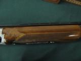 6257 Browning Citori Grade 5 1981 mfg,hand engraved, 12 gauge, 28 barrels, mod/full, long tang silver receiver, 3 pheasants one side duck other,98-99
- 4 of 14