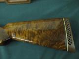 6257 Browning Citori Grade 5 1981 mfg,hand engraved, 12 gauge, 28 barrels, mod/full, long tang silver receiver, 3 pheasants one side duck other,98-99
- 7 of 14