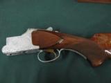 6257 Browning Citori Grade 5 1981 mfg,hand engraved, 12 gauge, 28 barrels, mod/full, long tang silver receiver, 3 pheasants one side duck other,98-99
- 8 of 14