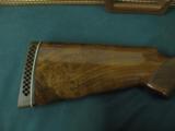 6257 Browning Citori Grade 5 1981 mfg,hand engraved, 12 gauge, 28 barrels, mod/full, long tang silver receiver, 3 pheasants one side duck other,98-99
- 9 of 14
