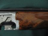 6257 Browning Citori Grade 5 1981 mfg,hand engraved, 12 gauge, 28 barrels, mod/full, long tang silver receiver, 3 pheasants one side duck other,98-99
- 6 of 14