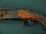 6292 Winchester 101 field 20 gauge 2 3/4 & 3 inch chambers, 26 inch barrel, skeet/skeet, pistol grip, sling swivels front red bead, Whiteline pad, 14
- 3 of 9
