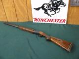 6292 Winchester 101 field 20 gauge 2 3/4 & 3 inch chambers, 26 inch barrel, skeet/skeet, pistol grip, sling swivels front red bead, Whiteline pad, 14
- 1 of 9