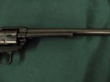 6315 Colt Single Action Buntline Scout 22 Long Rifle 9 1/2 inch barrel correct box and oil paper, black composite grips, no drag line, 99% condition,
- 3 of 12