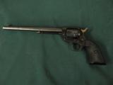 6315 Colt Single Action Buntline Scout 22 Long Rifle 9 1/2 inch barrel correct box and oil paper, black composite grips, no drag line, 99% condition,
- 7 of 12