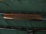 6516 Remington 1100 Classic Field 410 gauge, 2 barrels, 24 inch barrel and 26 inch barrel, skeet, ic and full screw in chokes and wrench. White diamon - 4 of 8
