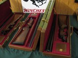 6584
Winchester Model 23 Classics 4 GUN SET ALL SAME SERIAL NUMBER.#006. GOLD RAISED RELIEF pheasants and quail on receiver bottom,vent rib,ejectors, - 3 of 14