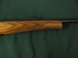 6600 Remington
Model 7 7MM short action ultra mag(SAUM)22 inch barrels, wood laminate composite stalk, butt pad, tools in green case, adjustable rear - 8 of 11