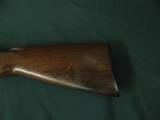 6681 Winchester 1897 pump 16 gauge 28 inch barrels full, Winchester butt plate, bore brite shiny,action is tite. good condition. exposed hammer. - 2 of 10