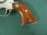 6953 Ruger Single 9 22 mag, NEW IN BOX, 6 inch barrel, 9 shot engraved cylinder, wood composite grip, stainless steel,
adjustable rear site, fiber op - 11 of 11