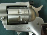 6953 Ruger Single 9 22 mag, NEW IN BOX, 6 inch barrel, 9 shot engraved cylinder, wood composite grip, stainless steel,
adjustable rear site, fiber op - 8 of 11