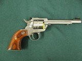 6953 Ruger Single 9 22 mag, NEW IN BOX, 6 inch barrel, 9 shot engraved cylinder, wood composite grip, stainless steel,
adjustable rear site, fiber op - 5 of 11