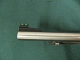 6953 Ruger Single 9 22 mag, NEW IN BOX, 6 inch barrel, 9 shot engraved cylinder, wood composite grip, stainless steel,
adjustable rear site, fiber op - 9 of 11