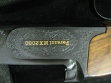 6964 Perazzi MX 2000 CUSTOM MATCHED PAIR gun#1 12ga 31 1/2 bls xf/f,gun #2 mod/full 31 1/2 bls, #1 is new unfired,#2 shot 200rds.both guns are identic - 8 of 12