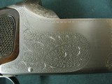 7018 Winchester 101 Pigeon 12 gauge 26 inch barrels, ic/mod, vent rib Decelerator pad lop
14 1/2, rose and scroll engraved coin silver receiver, ejec - 9 of 13