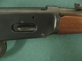7192 Winchester model 94 30/30 1966 mfg, unfired, factory blue did not take on receiver, chip below the fornend site line. tiger striped, all original - 11 of 13