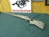 7228 Winchester model 70 Coyote 308 caliber Grey Laminate wood, thumbhole, Winchester pad, 99% condition,medium stainless steel barrel, scope bases.I - 1 of 13