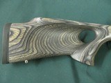 7228 Winchester model 70 Coyote 308 caliber Grey Laminate wood, thumbhole, Winchester pad, 99% condition,medium stainless steel barrel, scope bases.I - 7 of 13