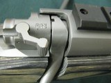 7228 Winchester model 70 Coyote 308 caliber Grey Laminate wood, thumbhole, Winchester pad, 99% condition,medium stainless steel barrel, scope bases.I - 12 of 13