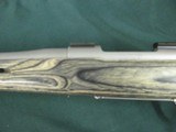 7228 Winchester model 70 Coyote 308 caliber Grey Laminate wood, thumbhole, Winchester pad, 99% condition,medium stainless steel barrel, scope bases.I - 4 of 13