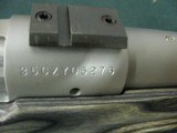 7228 Winchester model 70 Coyote 308 caliber Grey Laminate wood, thumbhole, Winchester pad, 99% condition,medium stainless steel barrel, scope bases.I - 11 of 13