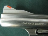 7262 Smith Wesson 66-2 Combat Magnum, 357 Mag. 4 inch barrel orange front site, square notched rear site, Pachmayr black checkerd grips,slight drap li - 6 of 9