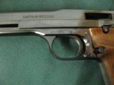 7289 Smith Wesson model 41 22 long rifle, 7 inch barrel with 1 inch muzzle brake for 8 inch total, target walnut grips with no marks,99% as new adjust - 6 of 12