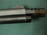 7289 Smith Wesson model 41 22 long rifle, 7 inch barrel with 1 inch muzzle brake for 8 inch total, target walnut grips with no marks,99% as new adjust - 11 of 12