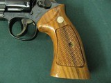 7301 Smith Wesson 14-4 38 special 8 3/8 inch barrel, adjustable rear site, medallion grips of walnut.NOt a mark on it. As new in box, papers tool and - 4 of 10