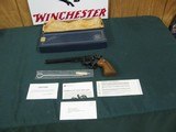 7301 Smith Wesson 14-4 38 special 8 3/8 inch barrel, adjustable rear site, medallion grips of walnut.NOt a mark on it. As new in box, papers tool and - 1 of 10