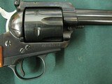 7323 Ruger Blackhawk 357 Magnum 4 1/2 inch barrel, flat top, protected rear adjustable site, wood medallion grips, 99% condition, this is the old 3 sc - 7 of 9