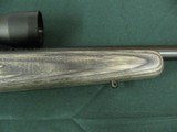 7352 Savage Mark II 22 long rifle, grey laminate stock, 3x9x45 Bushnell scope, 99.9% condition, medium weight barrel, not a mark on it. dont miss this - 13 of 13