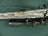 7352 Savage Mark II 22 long rifle, grey laminate stock, 3x9x45 Bushnell scope, 99.9% condition, medium weight barrel, not a mark on it. dont miss this - 9 of 13