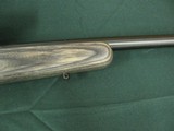 7352 Savage Mark II 22 long rifle, grey laminate stock, 3x9x45 Bushnell scope, 99.9% condition, medium weight barrel, not a mark on it. dont miss this - 12 of 13