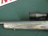 7352 Savage Mark II 22 long rifle, grey laminate stock, 3x9x45 Bushnell scope, 99.9% condition, medium weight barrel, not a mark on it. dont miss this - 4 of 13