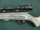 7352 Savage Mark II 22 long rifle, grey laminate stock, 3x9x45 Bushnell scope, 99.9% condition, medium weight barrel, not a mark on it. dont miss this - 3 of 13